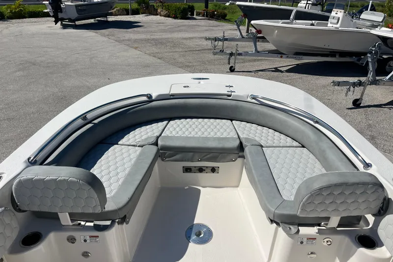 Slide: The Image of 2025 Carolina Skiff 21 Ultra Elite boat with cushioned seating and sleek design. - 10