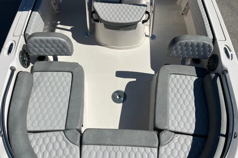 Slide: The Image of 2025 Carolina Skiff 21 Ultra Elite boat interior with gray cushioned seating. - 12