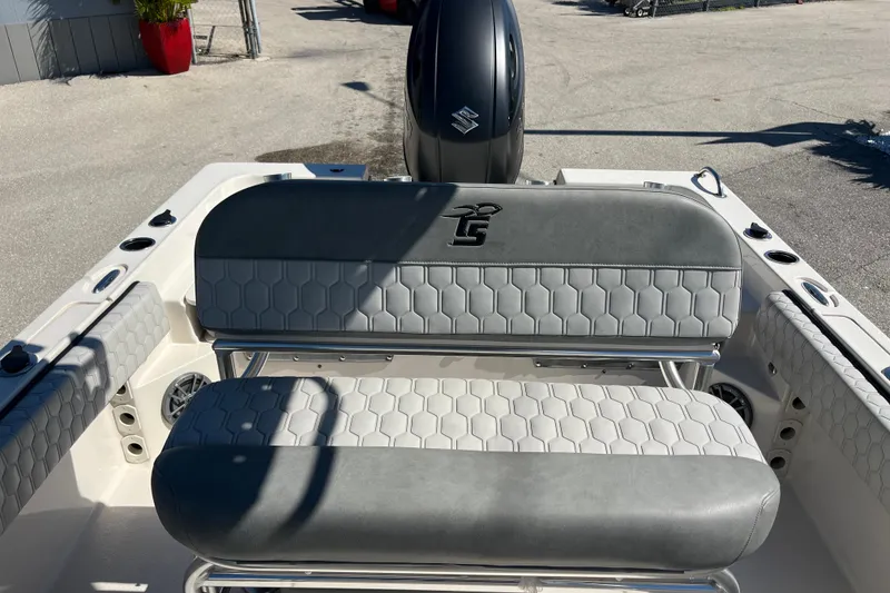 Slide: The Image of 2025 Carolina Skiff 21 Ultra Elite boat interior with gray seating and hexagonal pattern. - 15