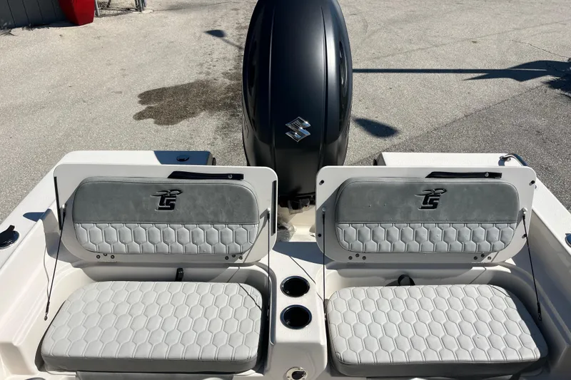 Slide: The Image of 2025 Carolina Skiff 21 Ultra Elite boat seats and engine, featuring sleek design and comfort. - 16