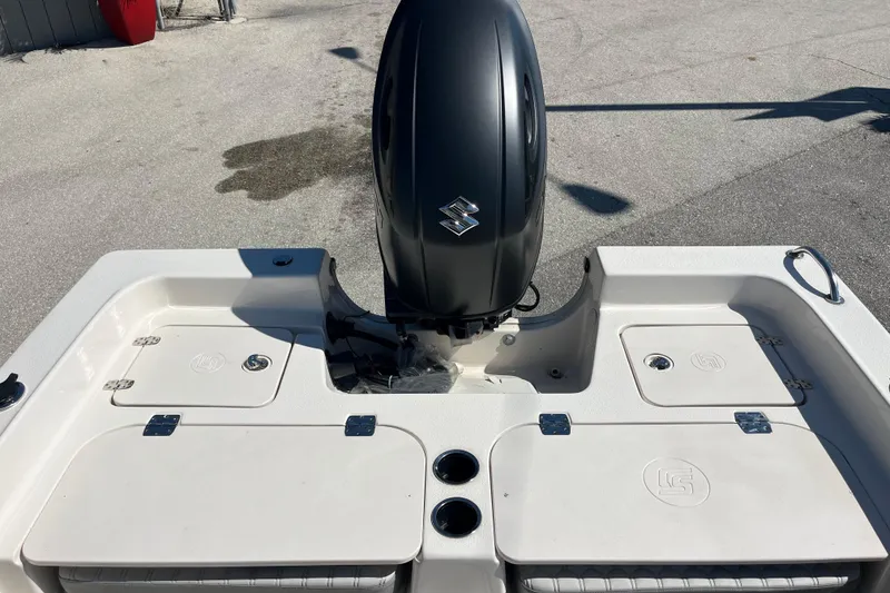 Slide: The Image of 2025 Carolina Skiff 21 Ultra Elite boat with Suzuki outboard motor, rear deck view. - 17