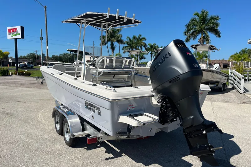 Slide: The Image of 2025 Carolina Skiff 21 Ultra Elite boat with Suzuki outboard motor on trailer. - 6