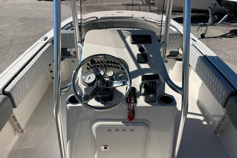 Slide: The Image of 2025 Carolina Skiff 21 Ultra Elite boat console with steering wheel and controls. - 9