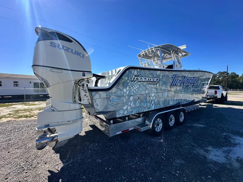 The Image of 2016 Freeman 37VH boat on trailer with Suzuki outboard motor. - 0