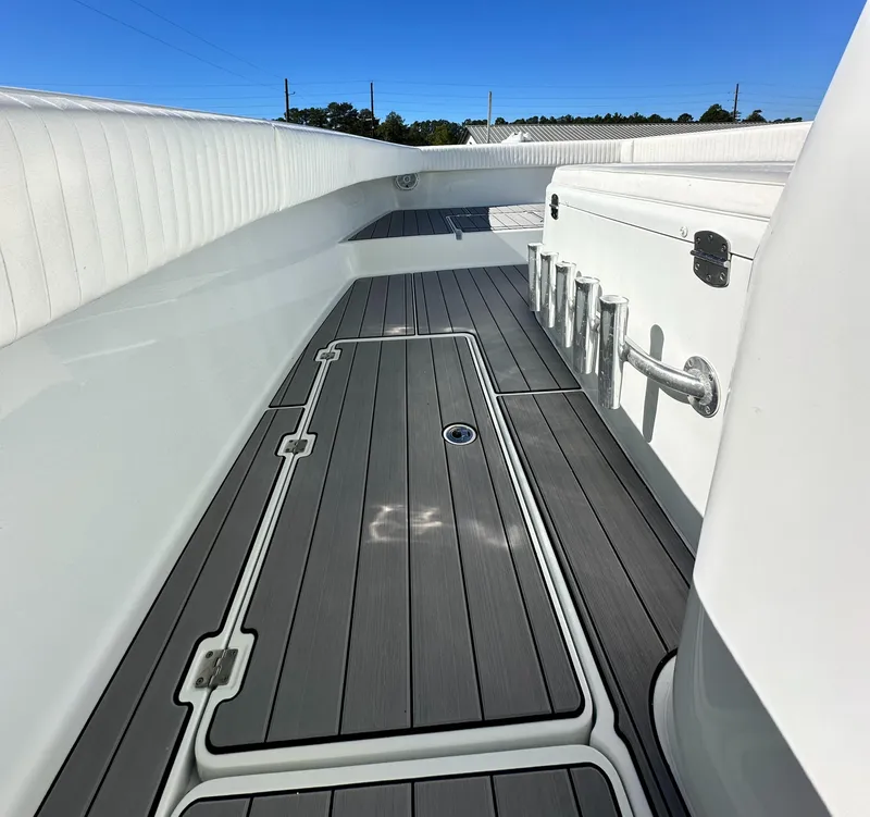 Slide: The Image of Freeman 37VH 2016 boat deck with storage compartments and rod holders. - 20