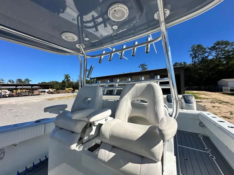 Slide: The Image of 2016 Freeman 37VH boat interior with dual seats and rod holders. - 36