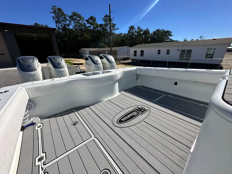 Slide: The Image of Freeman 37VH 2016 boat deck with multiple outboard motors, docked outdoors. - 38