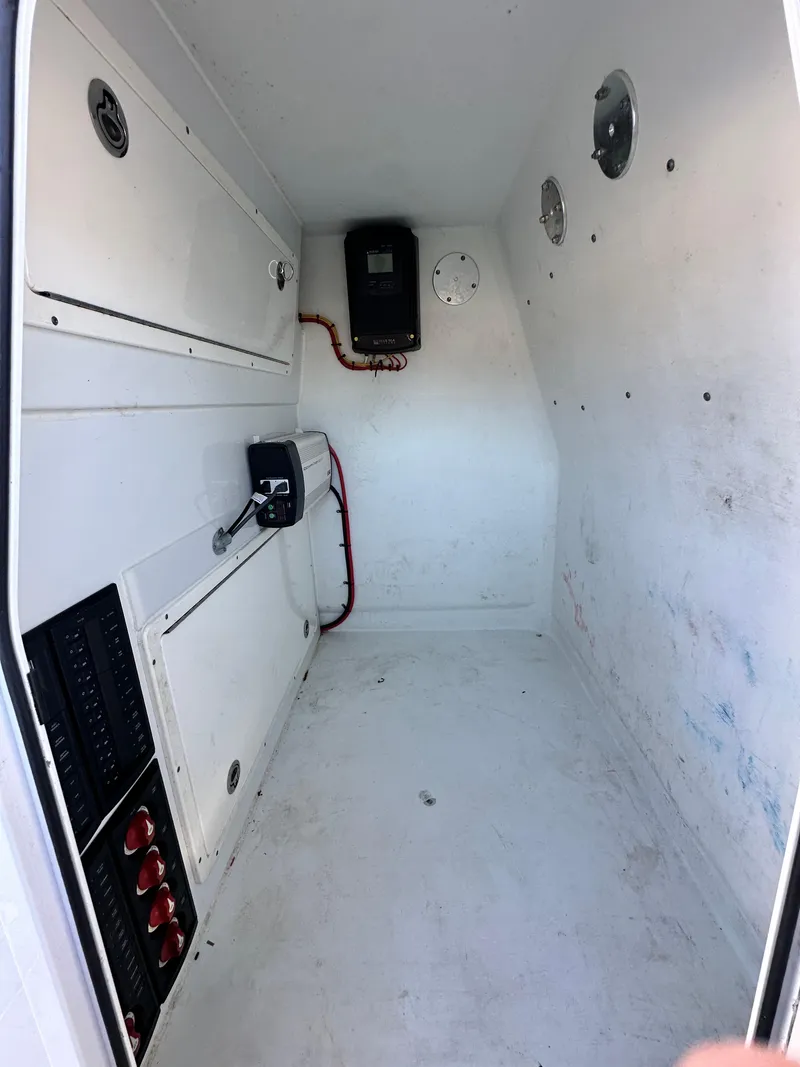Slide: The Image of Interior of a 2016 Freeman 37VH boat compartment with electrical panels. - 40