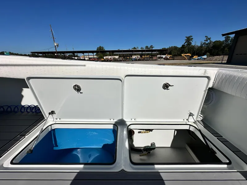 Slide: The Image of Open storage compartments on a 2016 Freeman 37VH boat deck. - 48