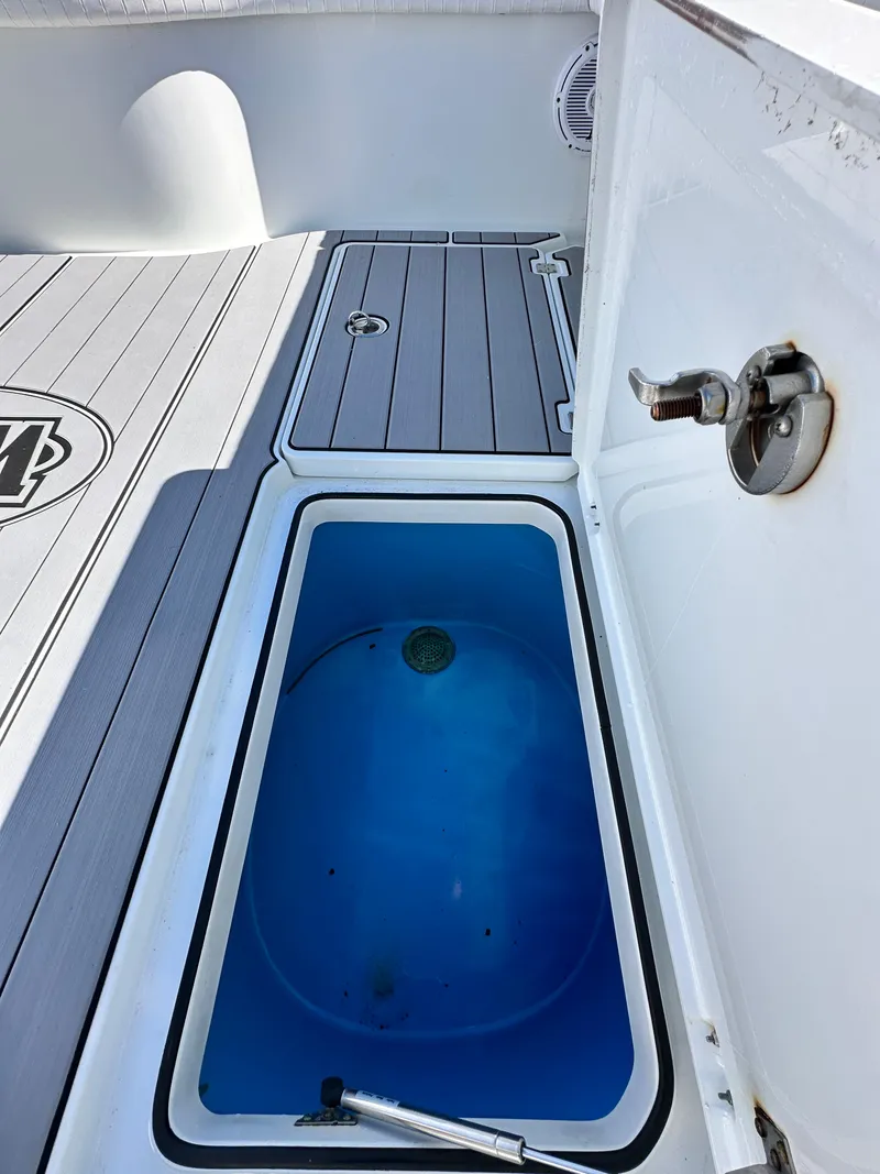 Slide: The Image of 2016 Freeman 37VH boat deck with open storage compartment. - 49