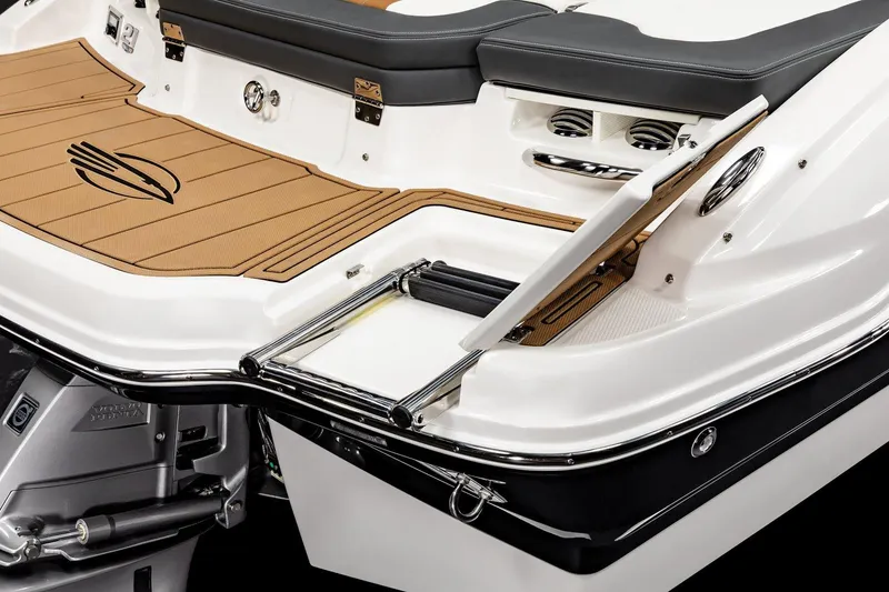 Slide: The Image of 2025 Chaparral 21 SSi boat with swim platform and ladder, featuring sleek design and teak-style flooring. - 14