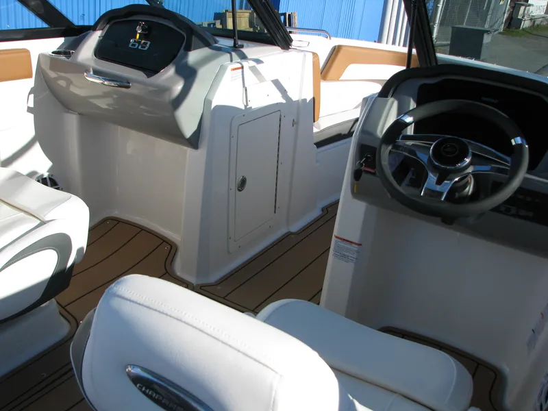 Slide: The Image of 2025 Chaparral 21 SSi boat interior with modern dashboard and steering wheel. - 6