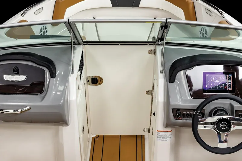 Slide: The Image of 2025 Chaparral 21 SSi boat interior with modern dashboard and steering wheel. - 7