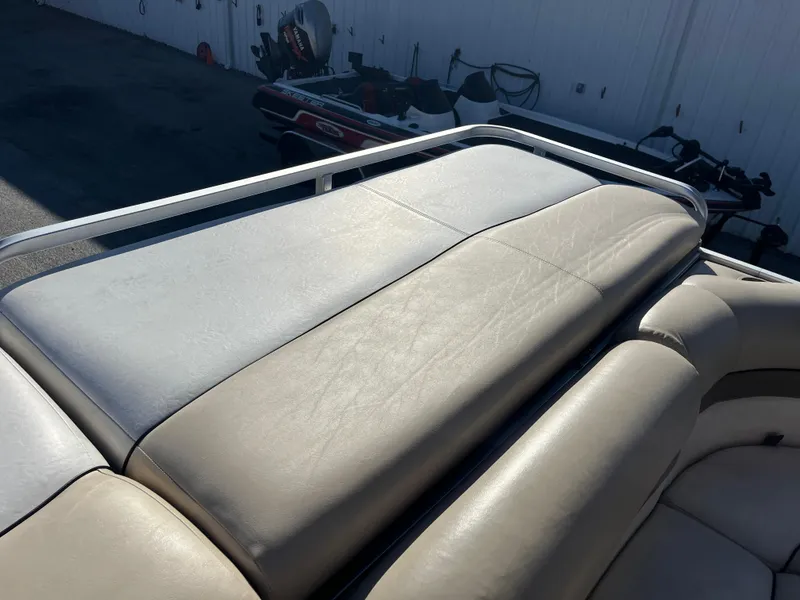 Slide: The Image of 2001 Sun Tracker PARTY BARGE 25 with beige seating and railing. - 24