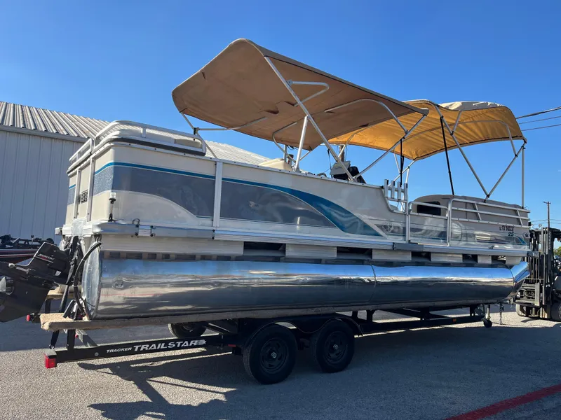 Slide: The Image of 2001 Sun Tracker PARTY BARGE 25 pontoon boat with canopy on a trailer. - 3