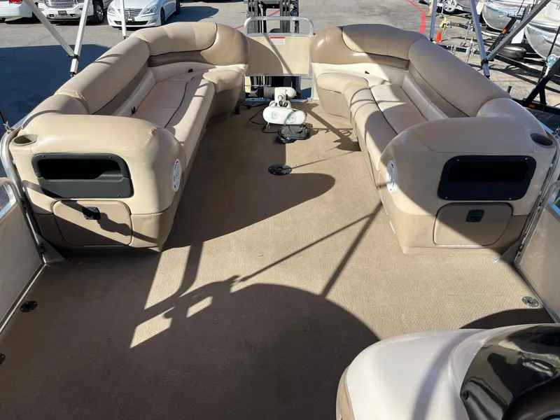 Slide: The Image of 2001 Sun Tracker PARTY BARGE 25 interior with beige seating and spacious deck. - 39