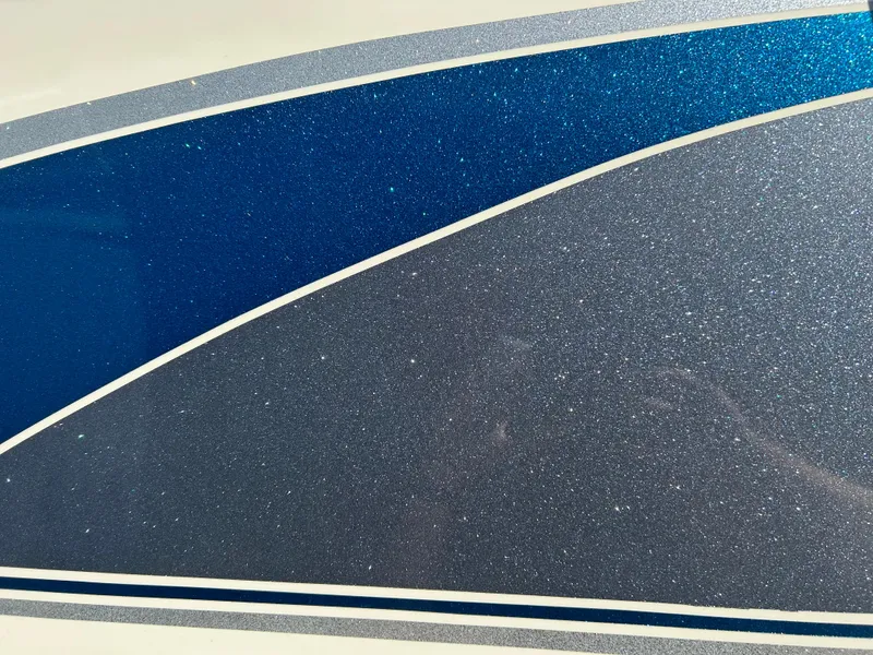 Slide: The Image of Close-up of 2001 Sun Tracker PARTY BARGE 25 boat with blue and gray design. - 8