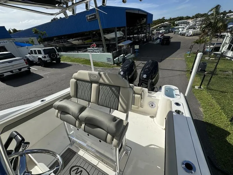 Slide: The Image of 2025 Key West 244 CC boat with dual engines at marina. - 10
