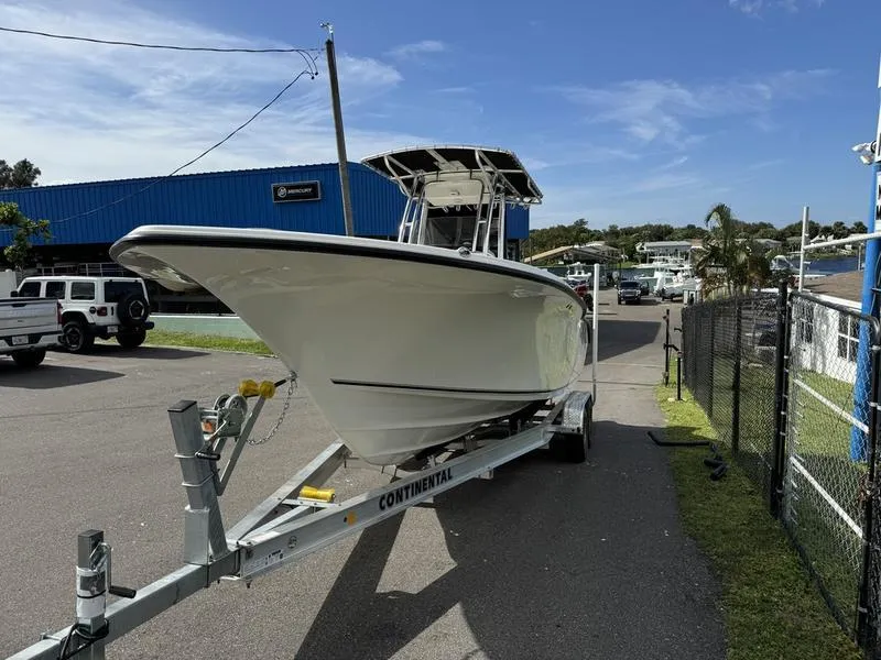 Slide: The Image of 2025 Key West 244 CC boat on trailer in marina parking lot. - 3