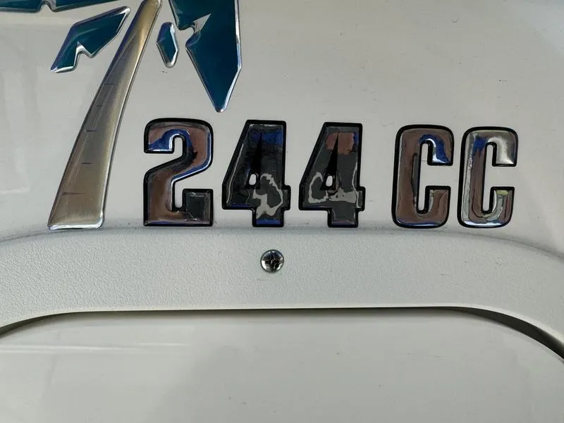 Slide: The Image of 2025 Key West 244 CC boat emblem with palm tree design. - 6