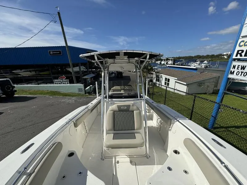 Slide: The Image of 2025 Key West 244 CC boat, white interior, marina background, sunny day. - 8