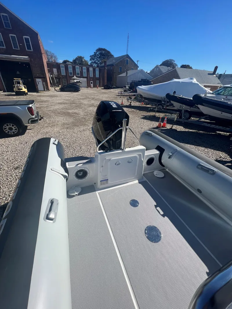 Slide: The Image of 2023 Protector 250 Chase boat interior in a sunny outdoor setting. - 12