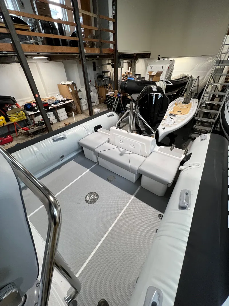 Slide: The Image of 2023 Protector 250 Chase boat interior in a workshop setting. - 6