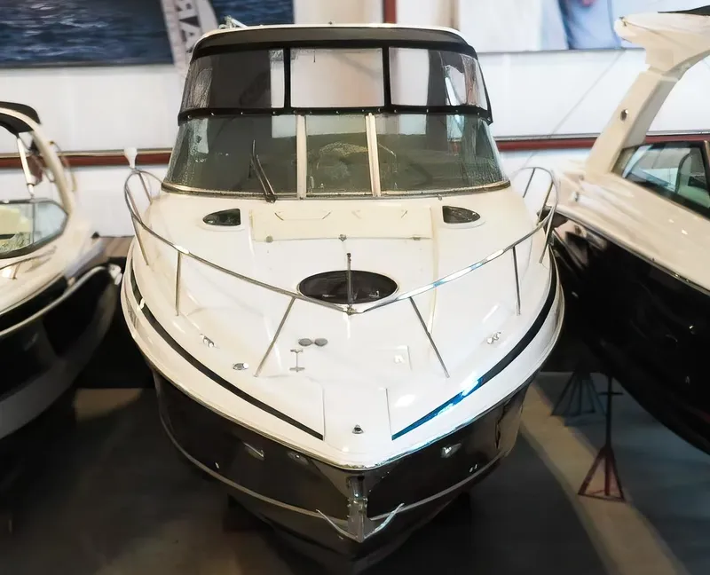 Slide: The Image of 2015 Regal 32 Express boat in showroom, front view. - 8