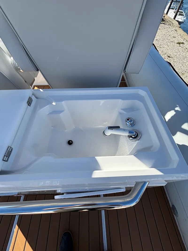 Slide: The Image of 2024 Protector 330 Chase boat sink with faucet on deck. - 17