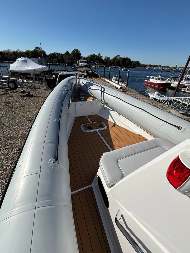 Slide: The Image of 2024 Protector 330 Chase boat docked by the waterfront. - 24