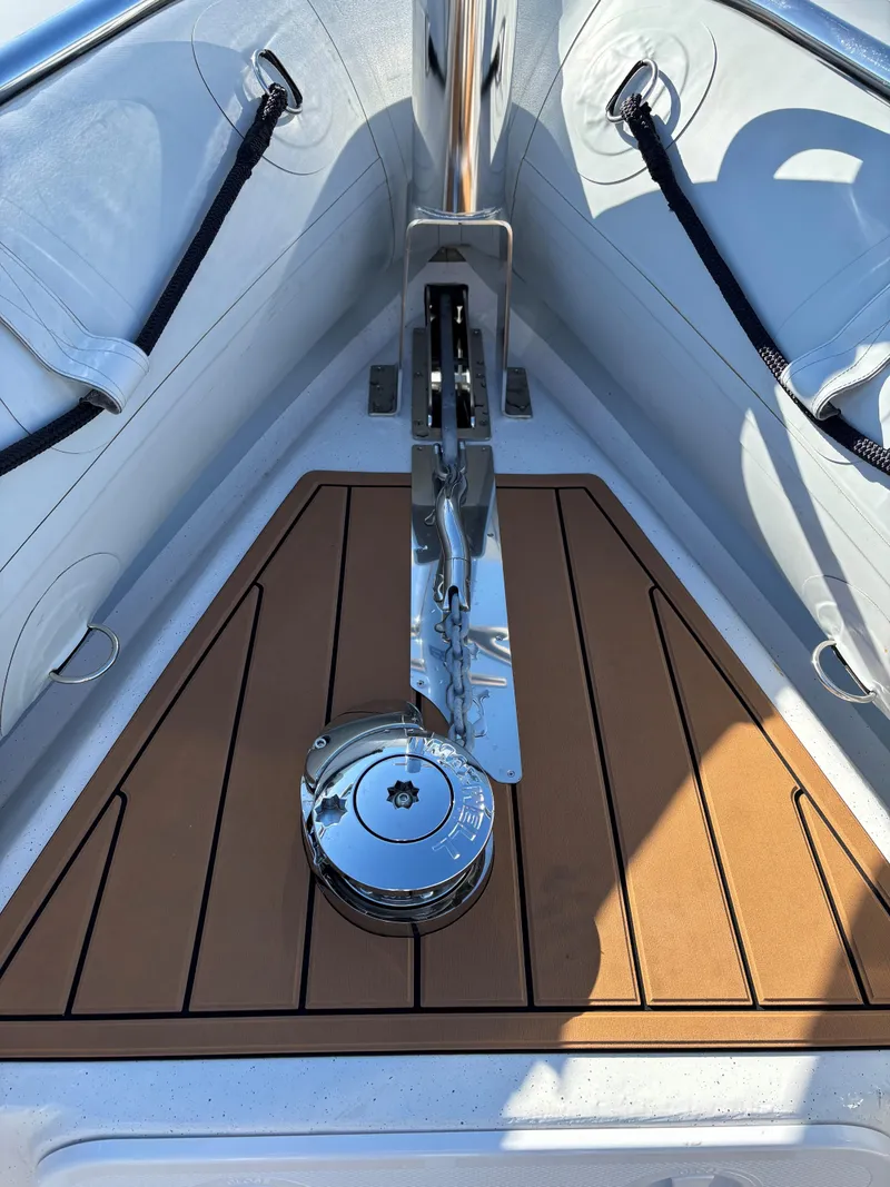 Slide: The Image of 2024 Protector 330 Chase boat anchor system with teak deck detail. - 26
