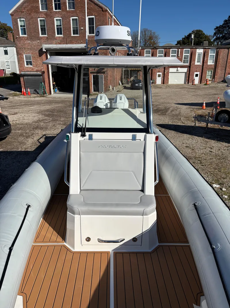 Slide: The Image of 2024 Protector 330 Chase boat with sleek design and spacious deck. - 3