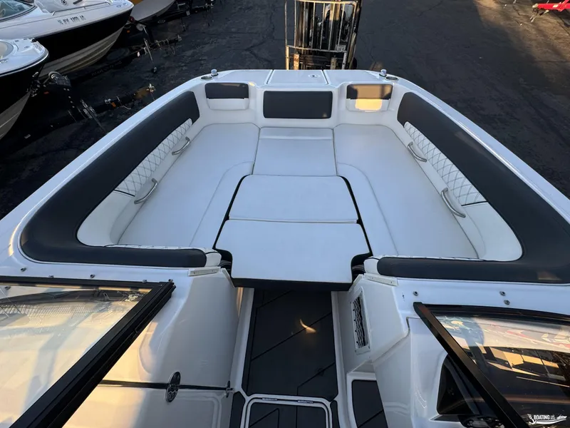 Slide: The Image of 2020 Bayliner DX2250 boat interior with spacious seating and modern design. - 5