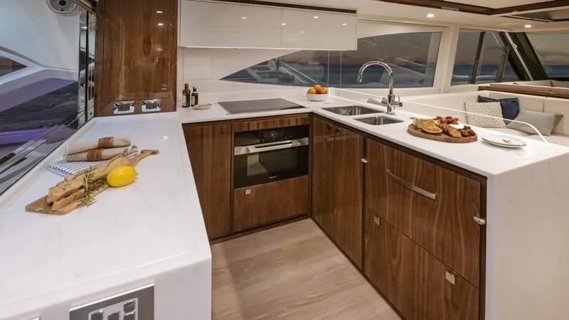 Slide: The Image of Luxurious kitchen interior of 2025 Riviera 6800 Sport Yacht Platinum Edition. - 19