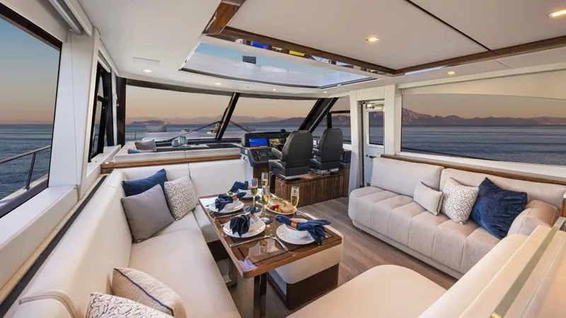 Slide: The Image of Luxurious interior of 2025 Riviera 6800 Sport Yacht Platinum Edition with elegant seating and ocean view. - 22