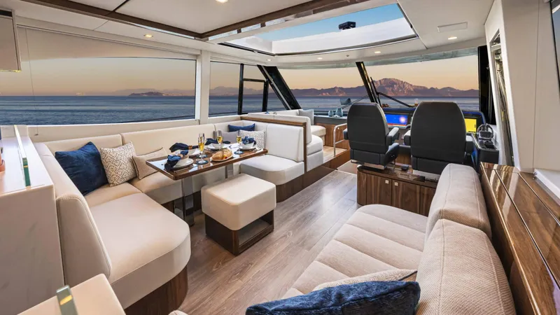 Slide: The Image of Luxurious interior of 2025 Riviera 6800 Sport Yacht Platinum Edition at sunset. - 23