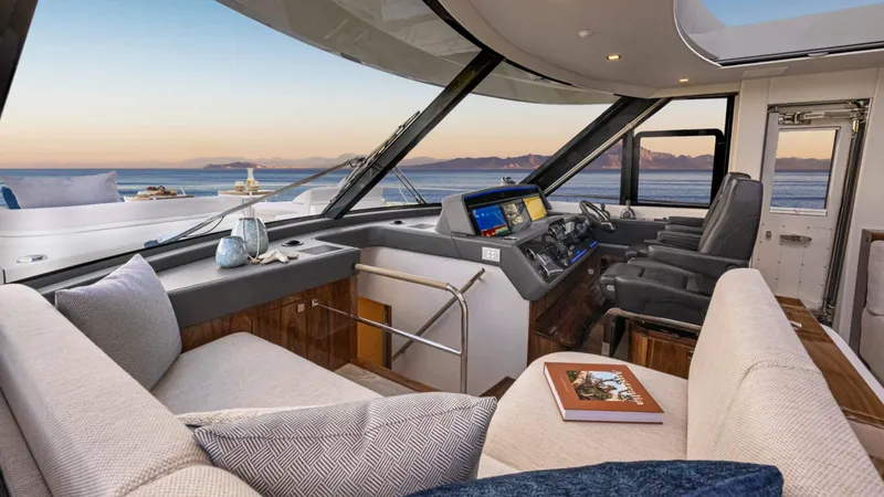 Slide: The Image of Luxurious interior of 2025 Riviera 6800 Sport Yacht Platinum Edition with panoramic ocean views. - 25