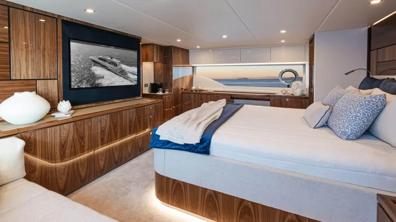 Slide: The Image of Luxurious interior of 2025 Riviera 6800 Sport Yacht Platinum Edition bedroom. - 27