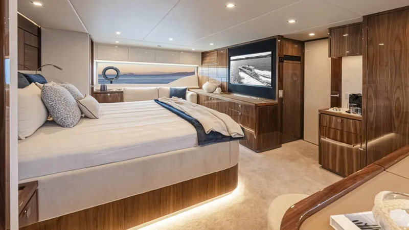 Slide: The Image of Luxurious interior of 2025 Riviera 6800 Sport Yacht Platinum Edition with elegant wood finishes. - 28