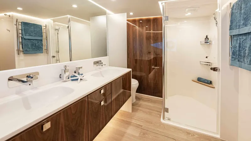 Slide: The Image of Luxurious bathroom in 2025 Riviera 6800 Sport Yacht Platinum Edition with modern fixtures. - 29