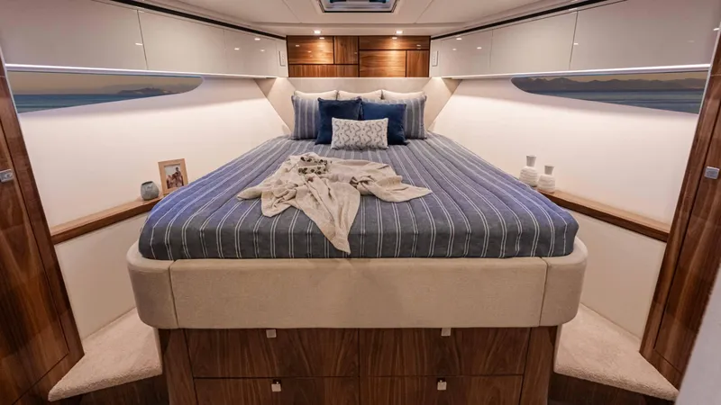 Slide: The Image of Luxurious bedroom interior of 2025 Riviera 6800 Sport Yacht Platinum Edition. - 31