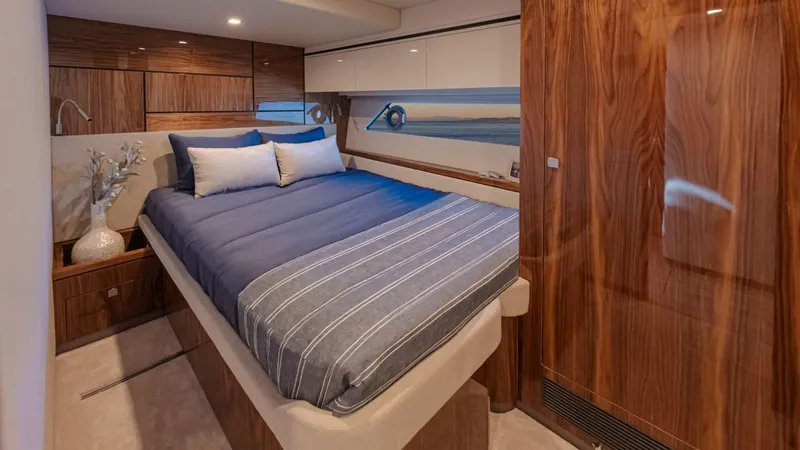 Slide: The Image of Luxurious bedroom interior of 2025 Riviera 6800 Sport Yacht Platinum Edition. - 33