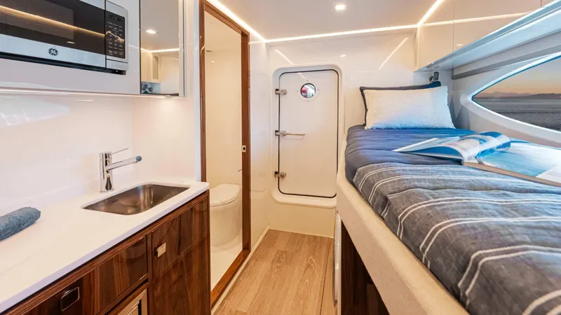 Slide: The Image of Luxurious interior of 2025 Riviera 6800 Sport Yacht Platinum Edition with modern amenities. - 36