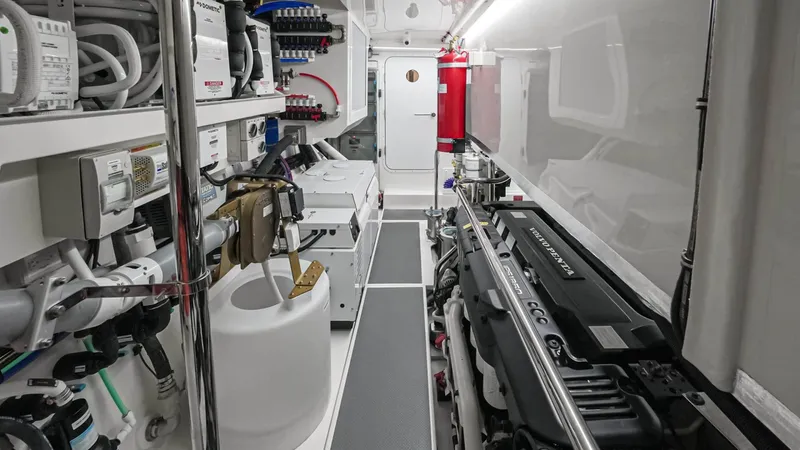 Slide: The Image of Engine room of 2025 Riviera 6800 Sport Yacht Platinum Edition, showcasing advanced machinery and equipment. - 37