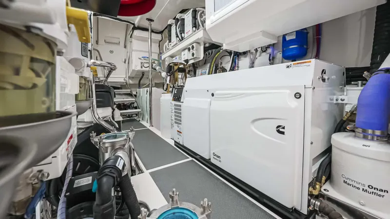 Slide: The Image of Engine room of 2025 Riviera 6800 Sport Yacht Platinum Edition, showcasing advanced marine equipment. - 38