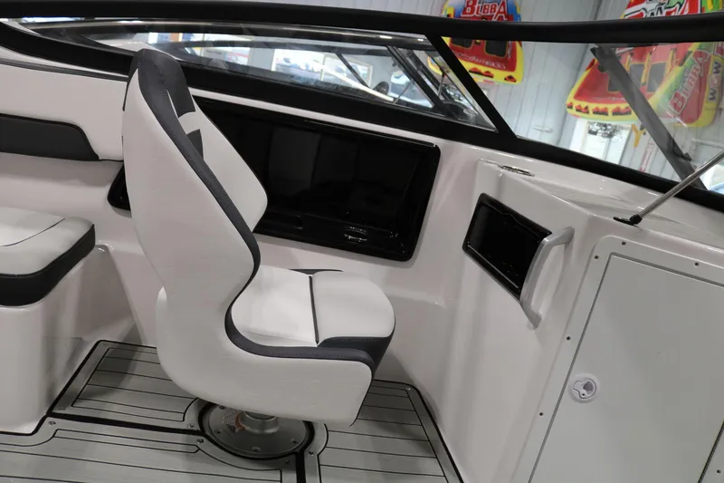 Slide: The Image of 2025 Yamaha Boats 195S interior with sleek white seating and modern dashboard. - 18