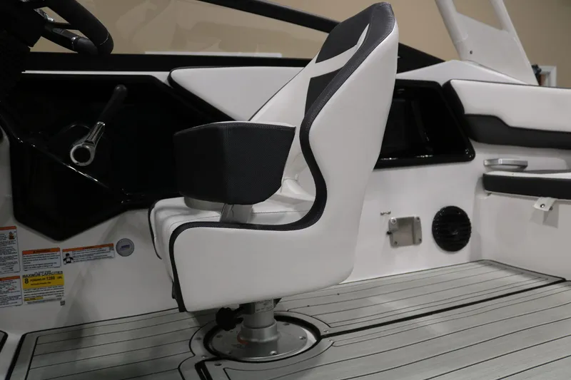 Slide: The Image of 2025 Yamaha Boats 195S interior with sleek white captain's chair and modern dashboard. - 20