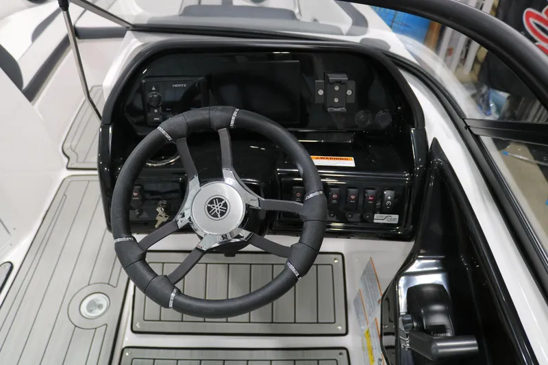 Slide: The Image of 2025 Yamaha Boats 195S steering wheel and dashboard interior view. - 22