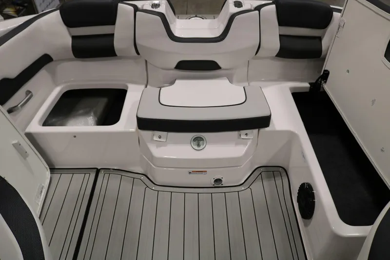 Slide: The Image of 2025 Yamaha Boats 195S interior seating and deck, featuring sleek design and modern upholstery. - 26
