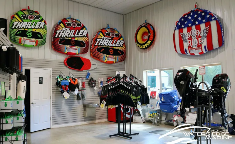 Slide: The Image of Marine store interior with water sports gear and Yamaha outboard motors, 2025. - 34